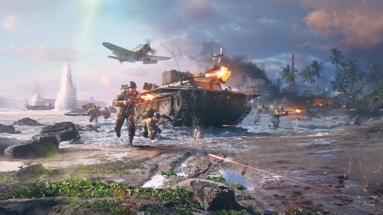 Infantry in jungle camouflage wade ashore beside a firing amphibious tank as fighter planes pass over a tropical beach.